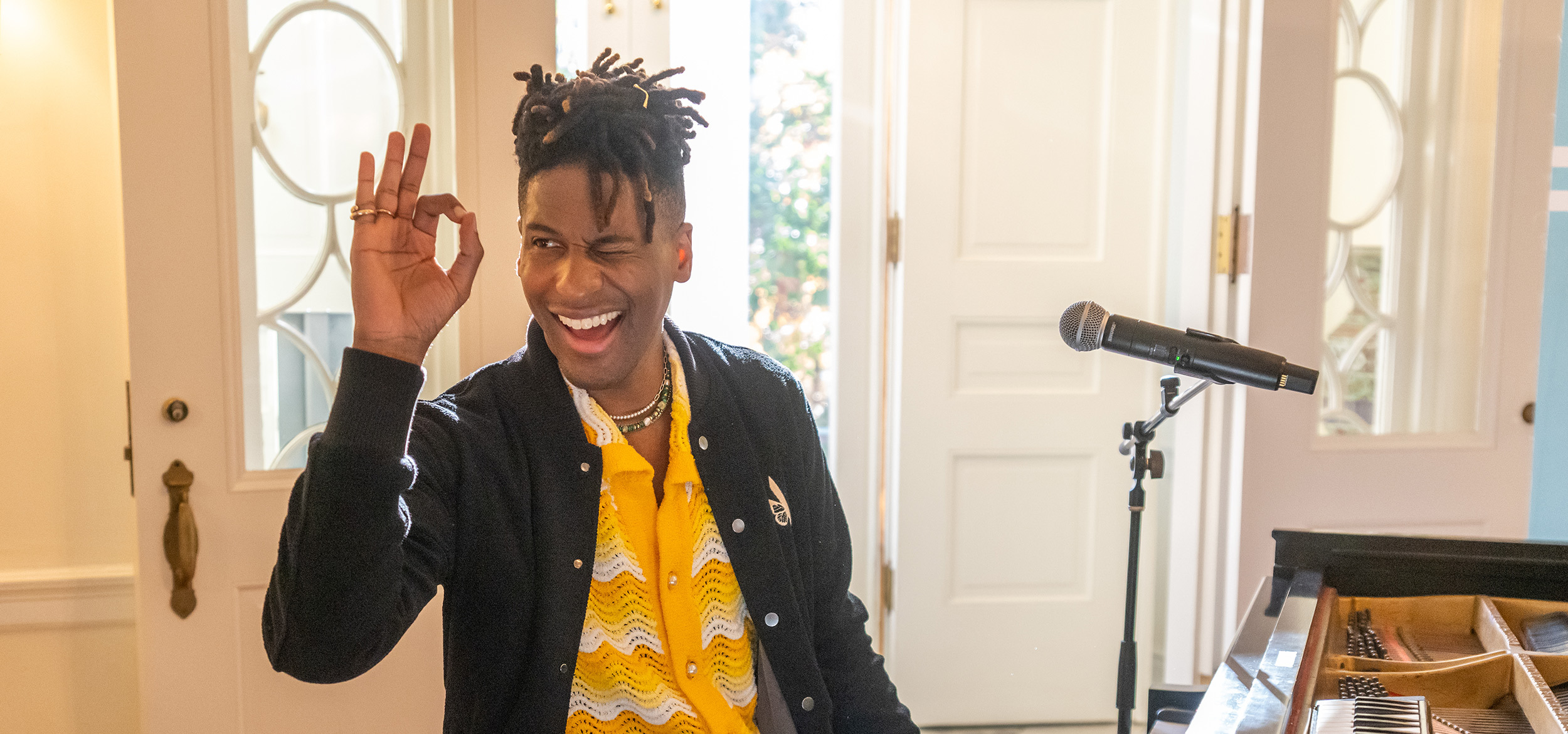 Jon Batiste playing the piano at Carr's Hill