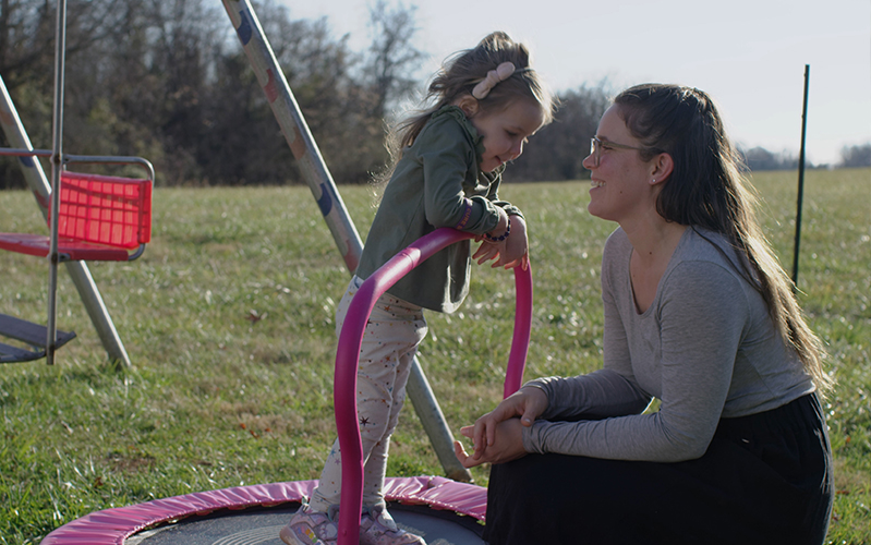 Mother looking at her daughter