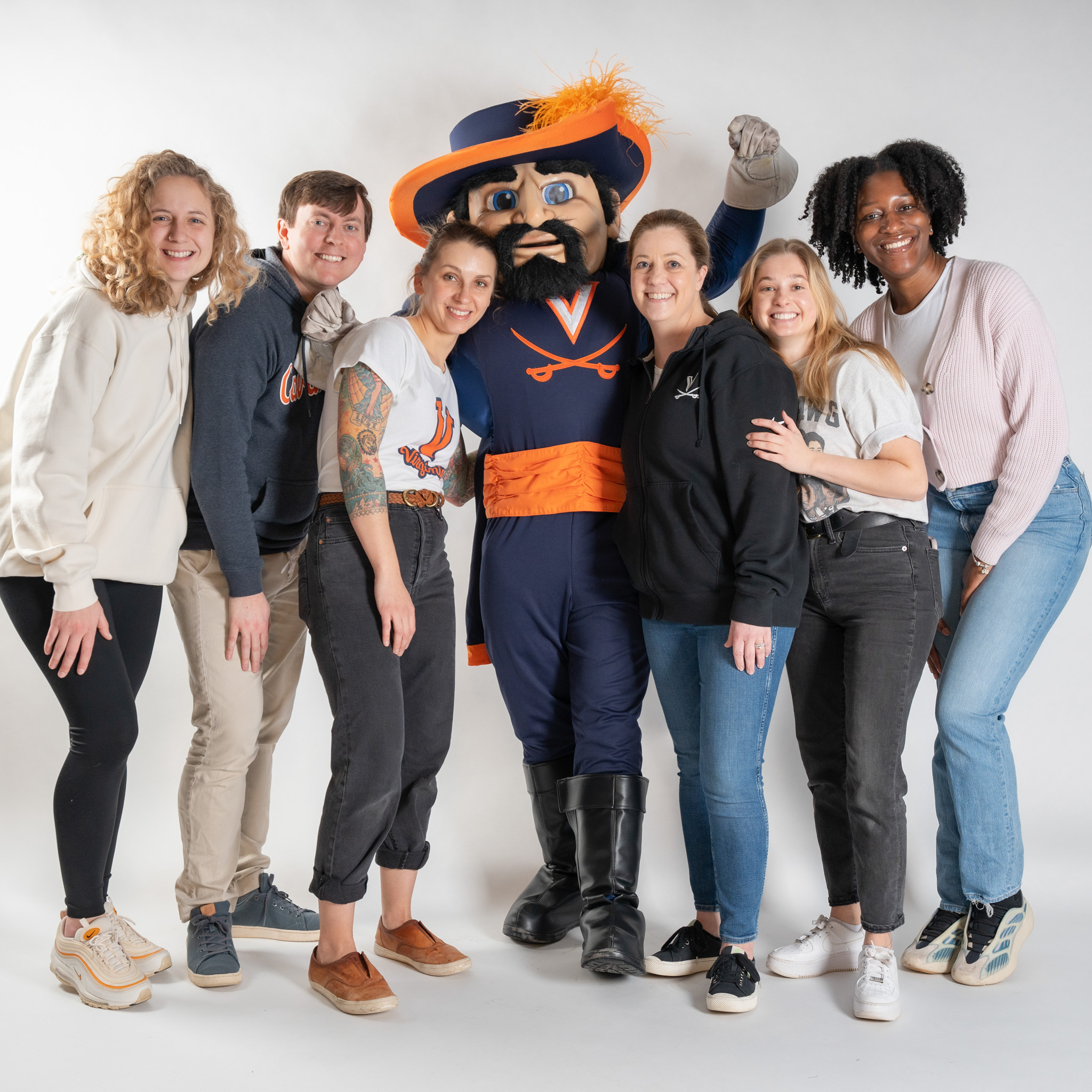 UVA Communications employees posing with Cav Man