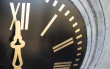 A close up shot of the Roman numerals I and II on the clock face