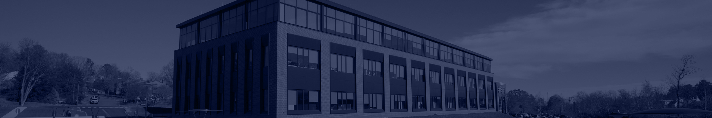 UVA Communications office building with a blue filter over it